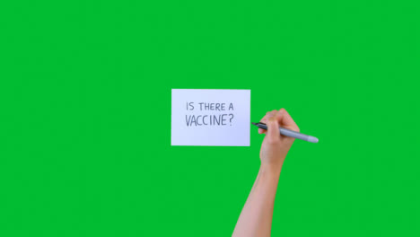 Mujer-Escribiendo-¿hay-Una-Vacuna-En-Papel-Con-Pantalla-Verde?